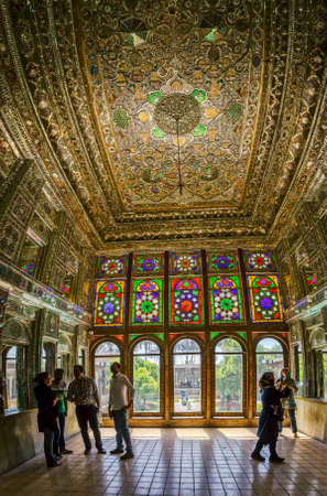 SHIRAZ, IRAN - MAY 2, 2015: Visitors take a tour of the beautiful interior of the Zinat ol Molk House inner courtyard it is a private house turned into a museum.のeditorial素材