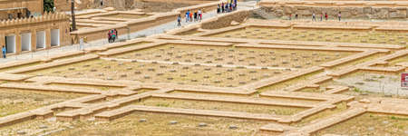 PERSEPOLIS, IRAN - MAY 3, 2015: Tourists take a tour of the Hundred Column Hall of the ruins of old city, a capital of the Achaemenid Empire 550 - 330 BC.のeditorial素材