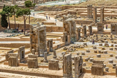 PERSEPOLIS, IRAN - MAY 3, 2015: Tourists take a tour of the ruins of old city, a capital of the Achaemenid Empire 550 - 330 BC.のeditorial素材