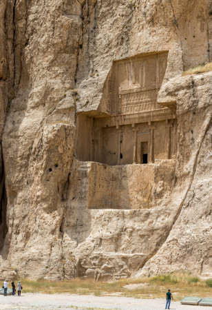 NAQSH-E RUSTAM, IRAN - MAY 3, 2015: The tourists in front of the historical monuments of ancient necropolis near ruins of old city Persepolis.のeditorial素材