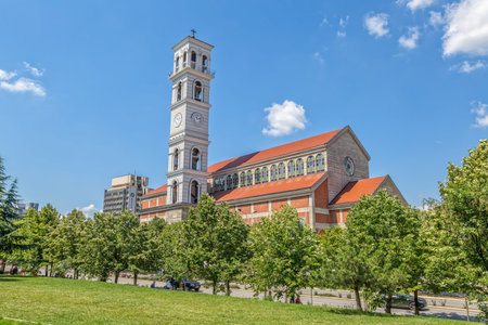 PRISTINA, KOSOVO - JULY 01, 2015: The Roman Catholic Cathedral of Blessed Mother Teresa view from the park in the city center.のeditorial素材