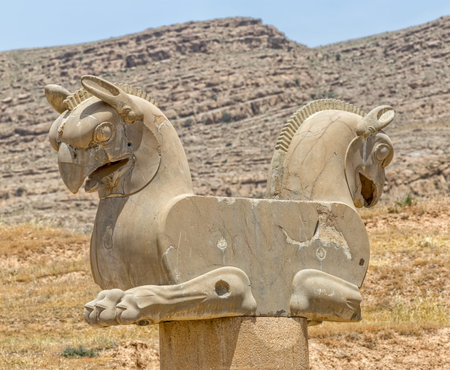 Sculpture of a Homa Bird in Persepolis, Iran. Two eagle-griffin capital has given the inspiration for the logo of Iran's National Airline Homa.の写真素材