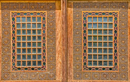View of the old wooden windows from inside garden of the old citadel Karmin Khan in the centre of the Shiraz city.の写真素材