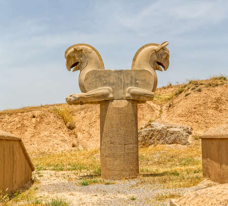 Sculpture of a Homa Bird in Persepolis, Iran. Two eagle-griffin capital has given the inspiration for the logo of Iran's National Airline Homa.の写真素材