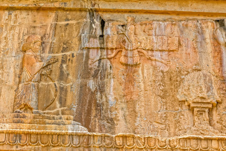 Faravahar Royal tombs facade detail of the Zoroastrianism, symbol on the ruins of old city Persepolis.の写真素材