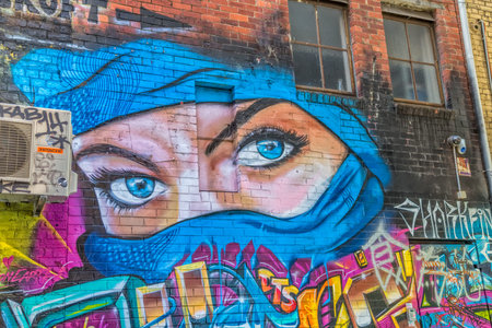 MELBOURNE, AUSTRALIA - MARCH 21, 2015: Colorful graffiti in Croft Alley in downtown, depicts an blue...