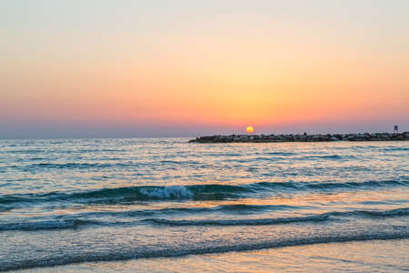 Beautiful sea sunset in Tel Aviv on Metzitzim beach, Israel.の写真素材