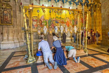 JERUSALEM, ISRAEL - JUNE 19, 2015: People make pilgrimages to the Stone of Anointing in Church of the Holy Sepulchre.のeditorial素材