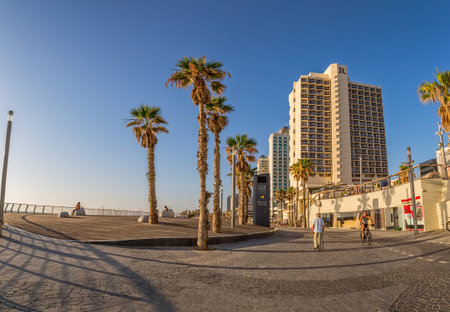 TEL AVIV, ISRAEL - JUNE 18, 2015: People enjoying the beautiful long promenade along the beach.