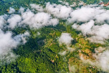Small mountain houses on the plateau on the mountain in Montenegro under the clouds.の写真素材