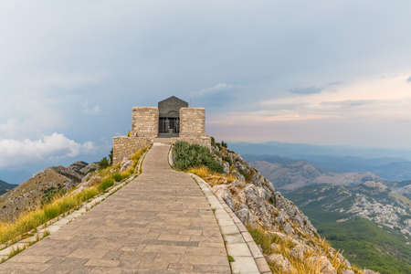 LOVCEN, MONTENEGRO - AUGUST 11, 2015: People sightseeing Njegos mausoleum in Lovcen mountain and national park in southwestern Montenegro. The mausoleum is a work of art by sculptor Ivan Mestrovic.のeditorial素材