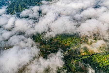 Small mountain houses on the plateau on the mountain in Montenegro under the clouds.の写真素材