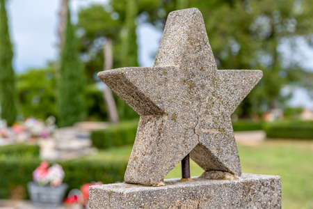 Concrete five-pointed star detail on grave of the partisan soldier in Tucepi, Croatia.の写真素材