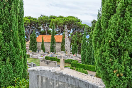 Virgin Mary old church on graveyard in Tucepi, Croatia.の写真素材