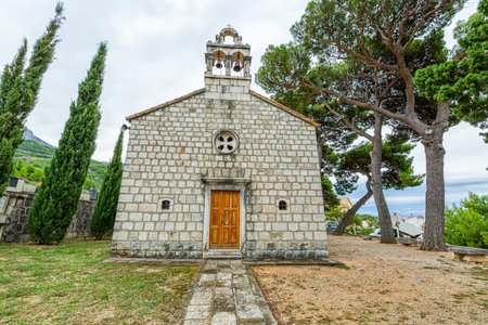 Virgin Mary church on graveyard in Tucepi, Croatia.