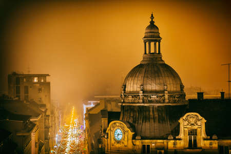 ZAGREB, CROATIA - December 18, 2016: Night aerial shot of the Frankopanska street old building with a clock from old Strossmayer promenade.のeditorial素材