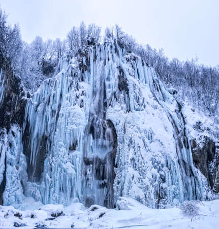 Plitvice lakes frozen large waterfallの写真素材