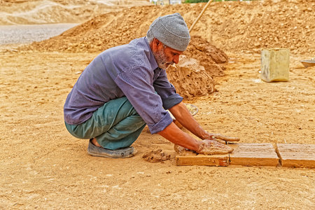 Clayman making bricks
