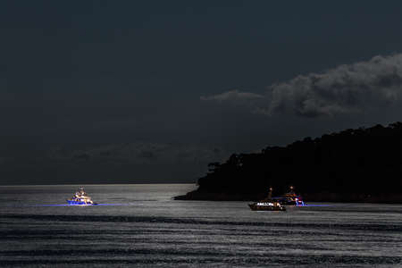 Boats by the night in Dubrovnik watersの写真素材