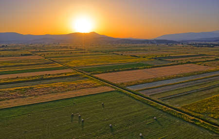 Aerial view of the fields near Sinj with hay bales in the countryside, Croatiaの写真素材