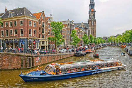 Amsterdam old houses reflection in river Amstelのeditorial素材