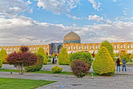 ISFAHAN, IRAN - MAY 9, 2015: People enjoying and relaxing in the Imam Square near Lotfollah Mosque.