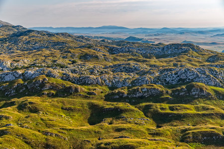 Helicopter aerial photo at sunrise of the Montenegro continental part and nature.