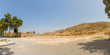 PERSEPOLIS, IRAN - MAY 3, 2015: Tourists take a tour of the Hundred Column Hall of the ruins of old...