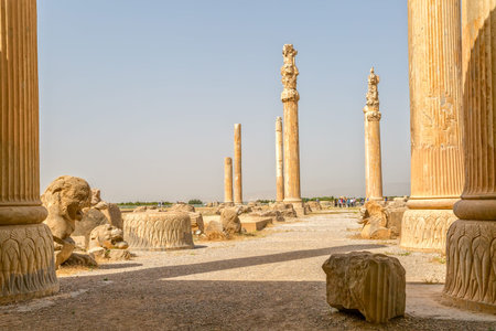 PERSEPOLIS, IRAN - MAY 3, 2015: Stone part of the old column in the shade inviting visitors to rest...