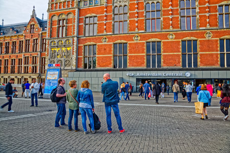 Amsterdam Centraal Station entrance main train station Netherlandsのeditorial素材