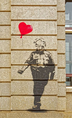 Amsterdam old house wall graffiti possible Banksy artのeditorial素材