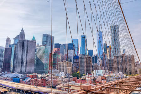 Manhattan through the Brooklyn Bridge cables in New Yorkのeditorial素材