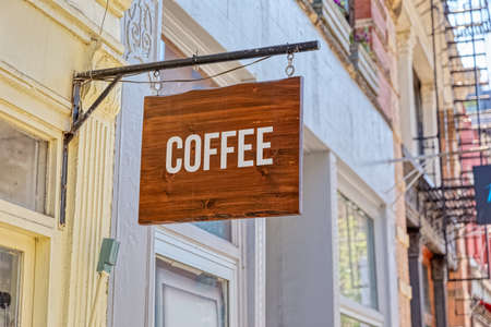 Wooden coffe sign on a facadeの写真素材