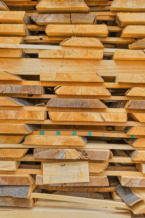 Stacked wood in the sawmill close up