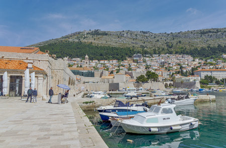 Dubrovnik old town harbor atmosphere with local small boats mooredのeditorial素材