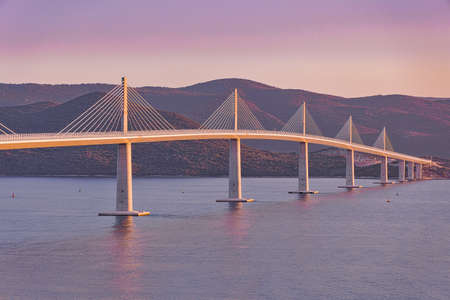 Aerial view of the Peljesac bridge at sunsetの写真素材