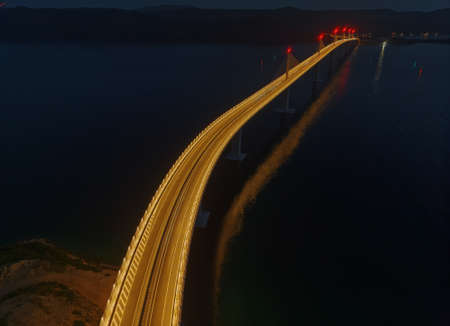 Aerial detail of the Peljesac bridge by nightの写真素材
