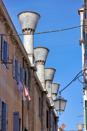 Cylindrical Chimneys of a Venetian House Along the Canalの写真素材