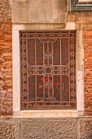 Venetian Antique Window: Hidden Red Flowerの写真素材