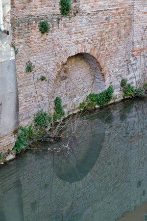 Charming Medieval Canal Scene in Padua Italyの写真素材