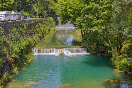 Pliva River Cascades through Historic Jajce, Bosnia and Herzegovinaのeditorial素材