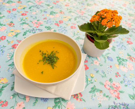 Butternut Squash Soup with Floral Aesthetics in Korculaの写真素材
