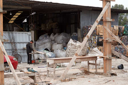 Argentina, Lomas of Zamora. June 2019. Informal workers perform sorting of recyclable materials in the municipal ecopoint.のeditorial素材