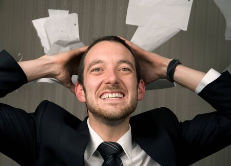 entrepreneur holds hands up with a happy expressionの写真素材