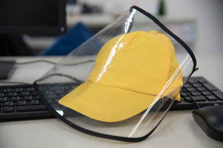 Yellow face shield protect covid-19 on the table