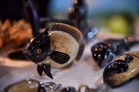 Ceramic fish in the showcase In the mallの写真素材