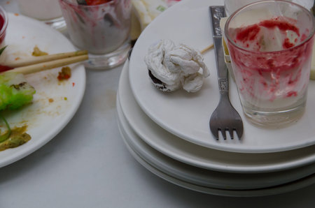 Food scraps on plates and glasses at a feast