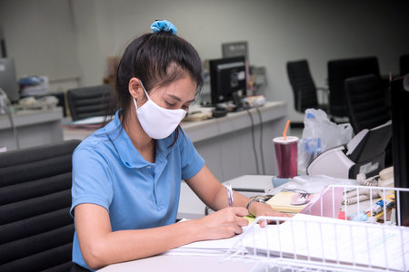 Asian women wearing medical masks working to prevent COVID-19: Nonthaburi, Thailand, 28 August 2020.のeditorial素材