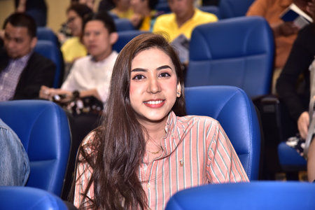 A beautiful woman watching a movie in a conference room 22 July 2019, Nonthaburi, Thailandのeditorial素材
