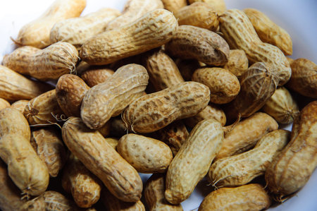 Boiled peanuts on a white plate